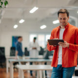 younger employee reviewing health plan